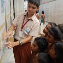 A student explaining about the stamps to Agama Patasala Vidyarthis